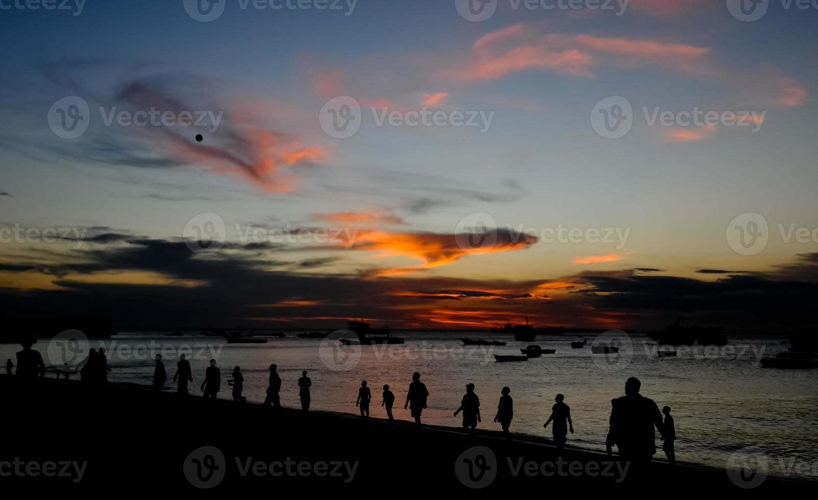 Football on the Beach at Sunset, Stone Town, Zanzibar photo