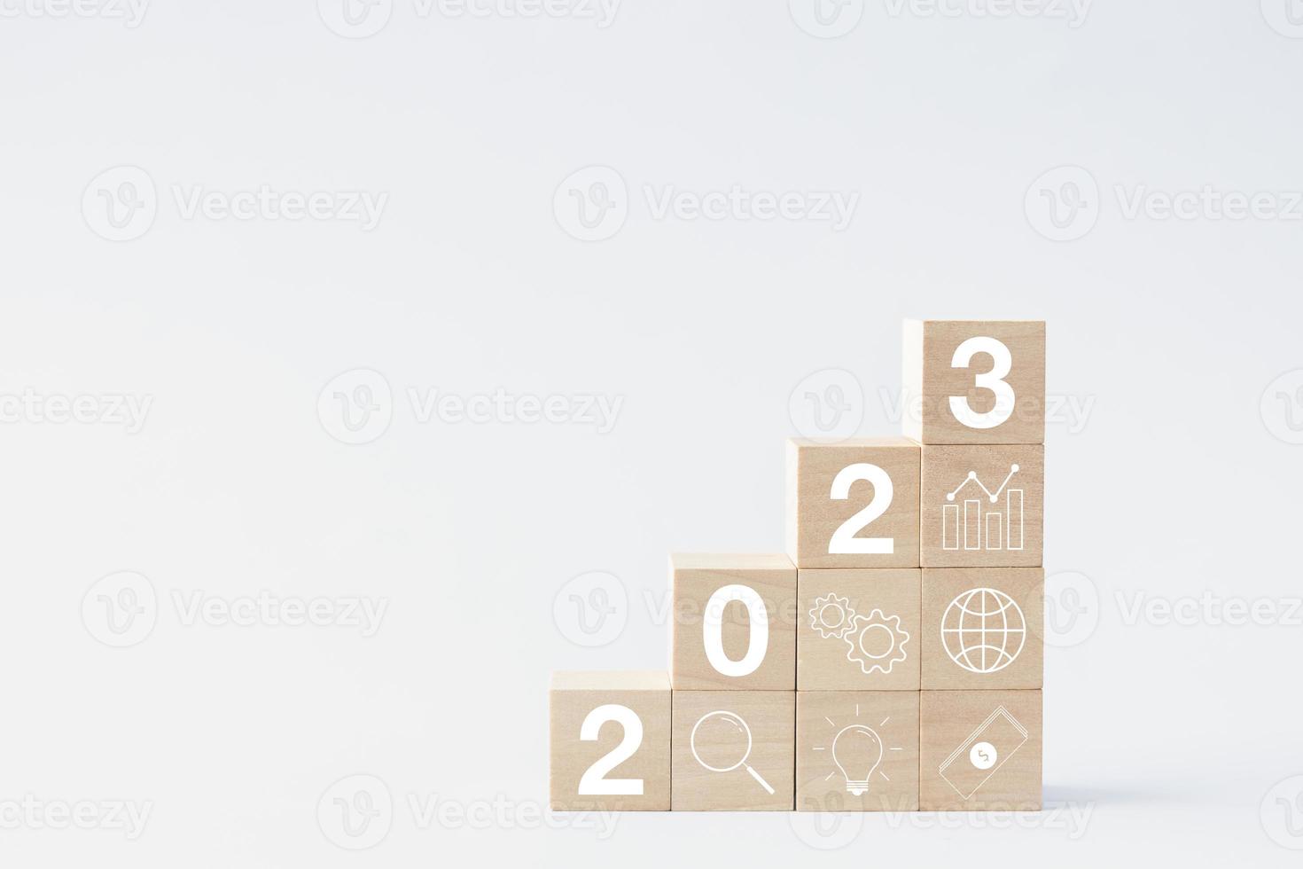 2023 business growing growth concept to success. woods block step with icon concept about business strategy, Action plan, Goal and target, hand stack, project, vision. photo