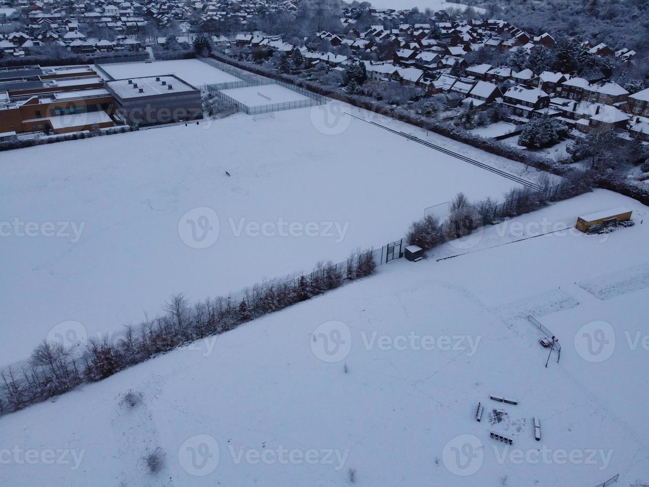 High angle view of Snow covered North Luton's landscape and Cityscape, Aerial Footage of Northern Luton City of England UK after Snow Fall. The 1st Snow Fall of this Winter of 2022 photo