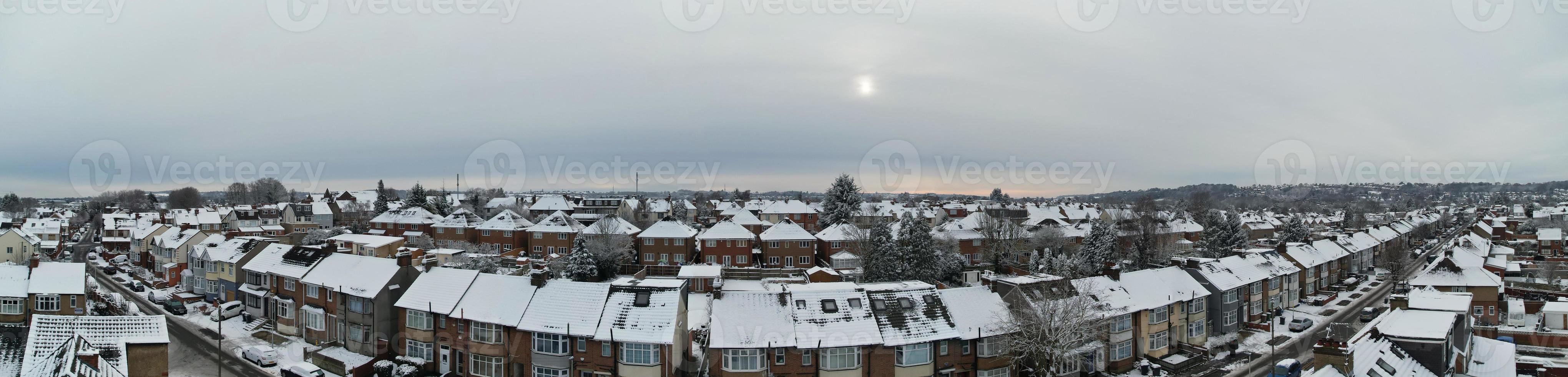 High angle view of Snow covered North Luton's landscape and Cityscape, Aerial Footage of Northern Luton City of England UK after Snow Fall. The 1st Snow Fall of this Winter of 2022 photo