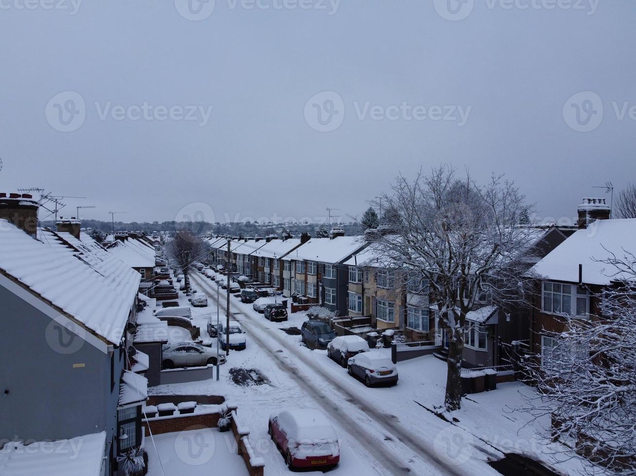 High angle view of Snow covered North Luton's landscape and Cityscape, Aerial Footage of Northern Luton City of England UK after Snow Fall. The 1st Snow Fall of this Winter of 2022 photo