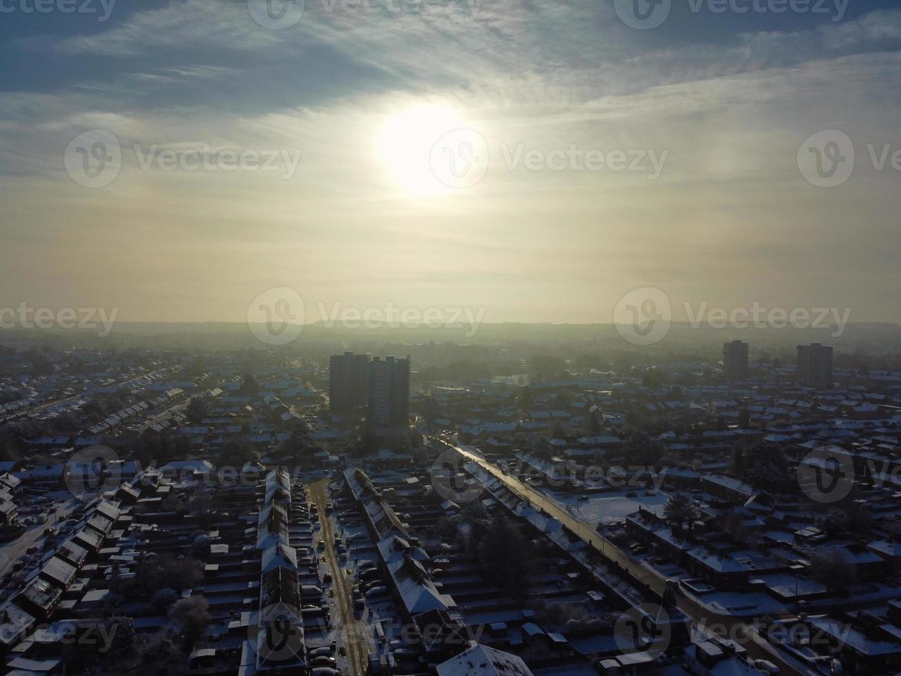 High angle view of Snow covered North Luton's landscape and Cityscape, Aerial Footage of Northern Luton City of England UK after Snow Fall. The 1st Snow Fall of this Winter of 2022 photo