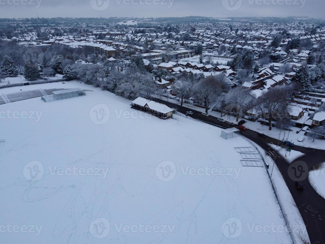 High angle view of Snow covered North Luton's landscape and Cityscape, Aerial Footage of Northern Luton City of England UK after Snow Fall. The 1st Snow Fall of this Winter of 2022 photo
