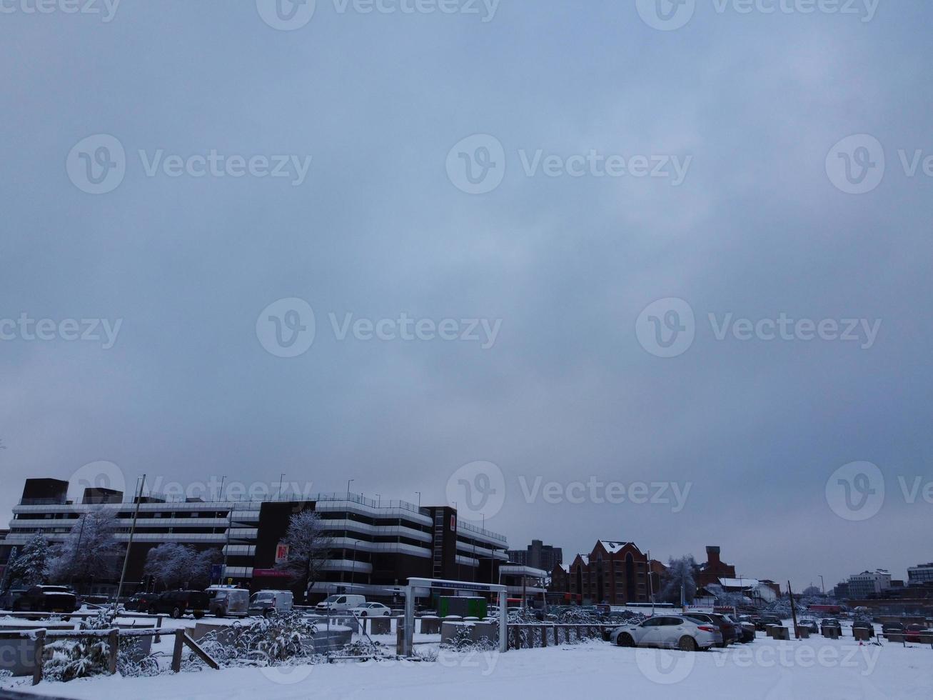 High angle view of Snow covered North Luton's landscape and Cityscape, Aerial Footage of Northern Luton City of England UK after Snow Fall. The 1st Snow Fall of this Winter of 2022 photo