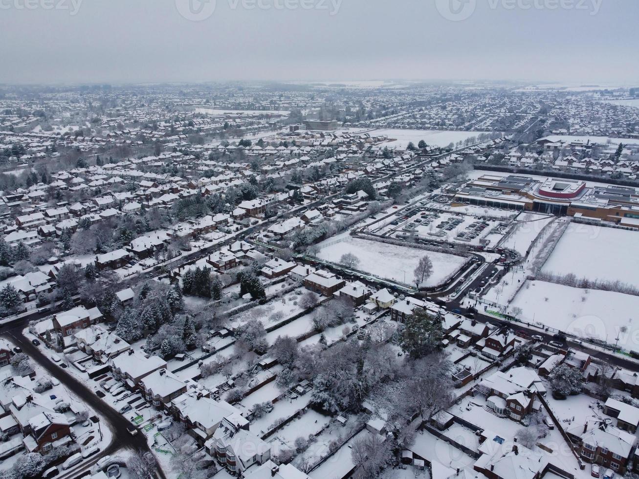 High angle view of Snow covered North Luton's landscape and Cityscape, Aerial Footage of Northern Luton City of England UK after Snow Fall. The 1st Snow Fall of this Winter of 2022 photo