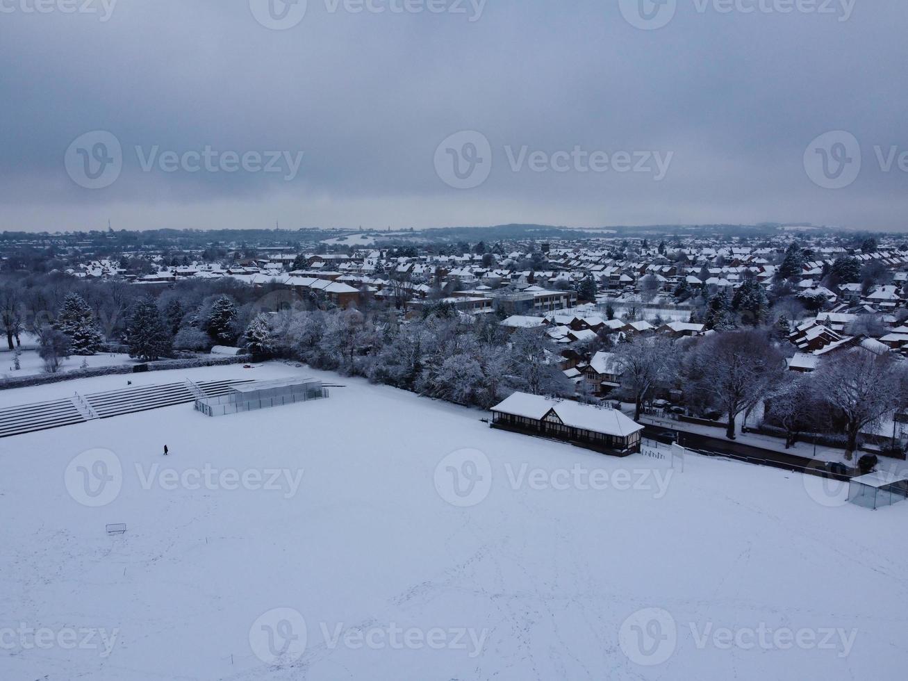 High angle view of Snow covered North Luton's landscape and Cityscape, Aerial Footage of Northern Luton City of England UK after Snow Fall. The 1st Snow Fall of this Winter of 2022 photo