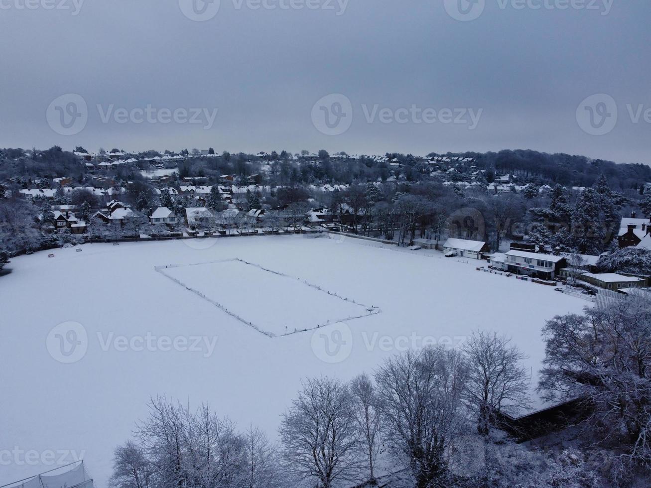 High angle view of Snow covered North Luton's landscape and Cityscape, Aerial Footage of Northern Luton City of England UK after Snow Fall. The 1st Snow Fall of this Winter of 2022 photo