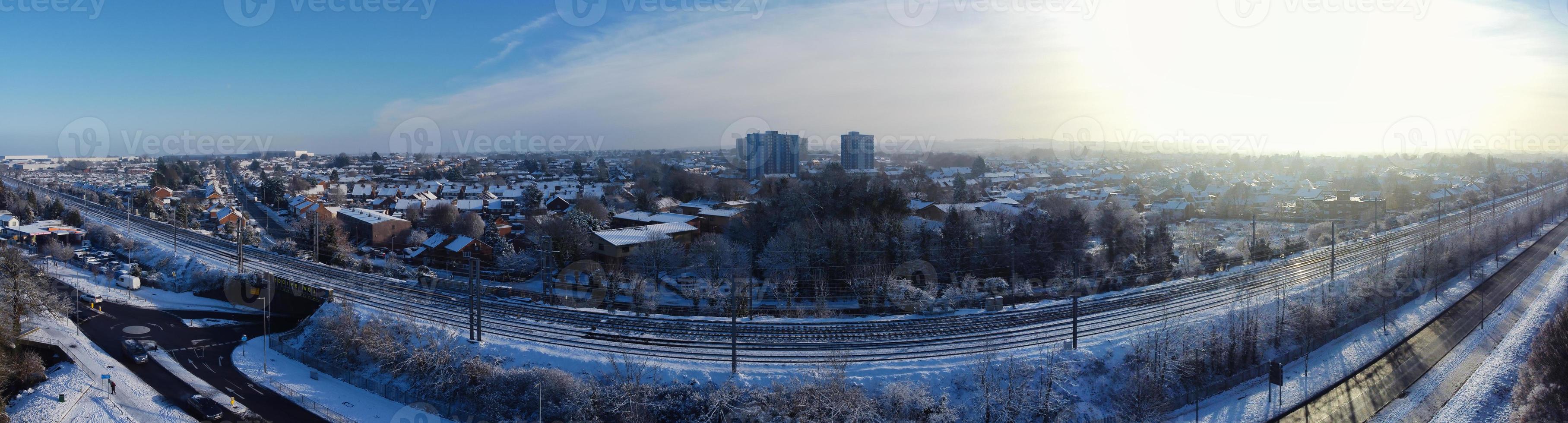 High angle view of Snow covered North Luton's landscape and Cityscape, Aerial Footage of Northern Luton City of England UK after Snow Fall. The 1st Snow Fall of this Winter of 2022 photo