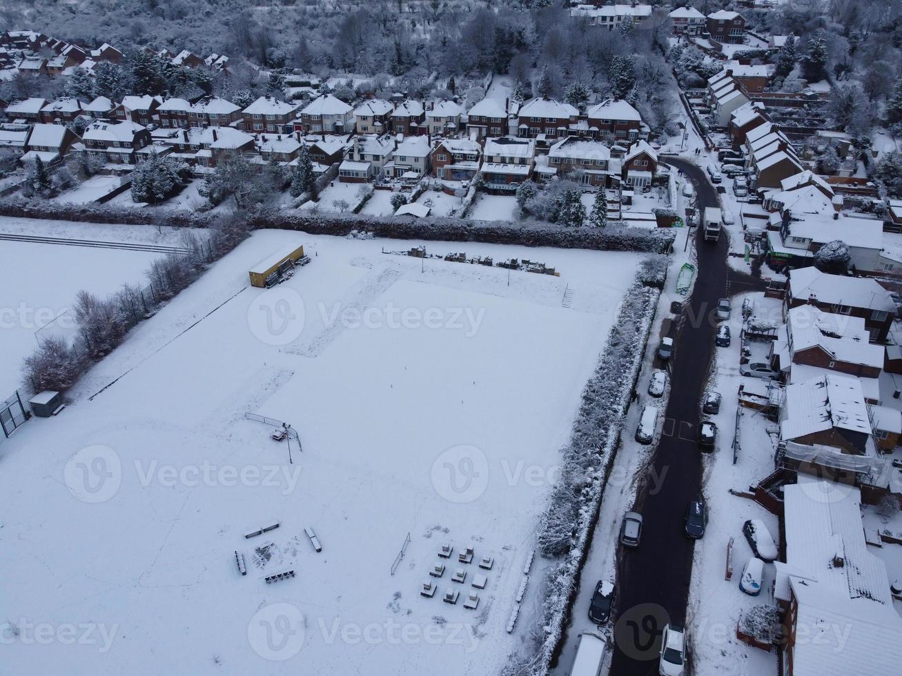 High angle view of Snow covered North Luton's landscape and Cityscape, Aerial Footage of Northern Luton City of England UK after Snow Fall. The 1st Snow Fall of this Winter of 2022 photo