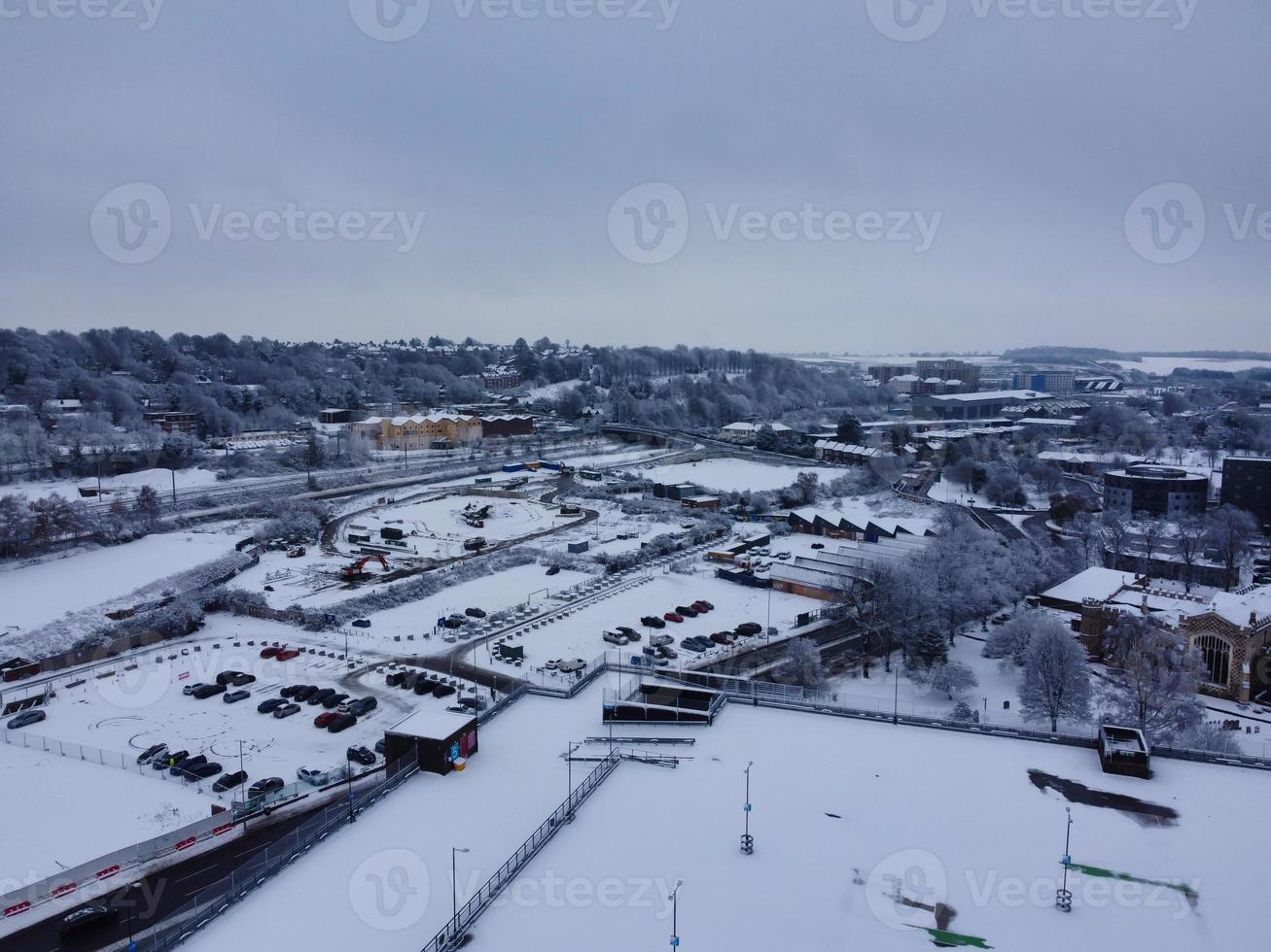 High angle view of Snow covered North Luton's landscape and Cityscape, Aerial Footage of Northern Luton City of England UK after Snow Fall. The 1st Snow Fall of this Winter of 2022 photo