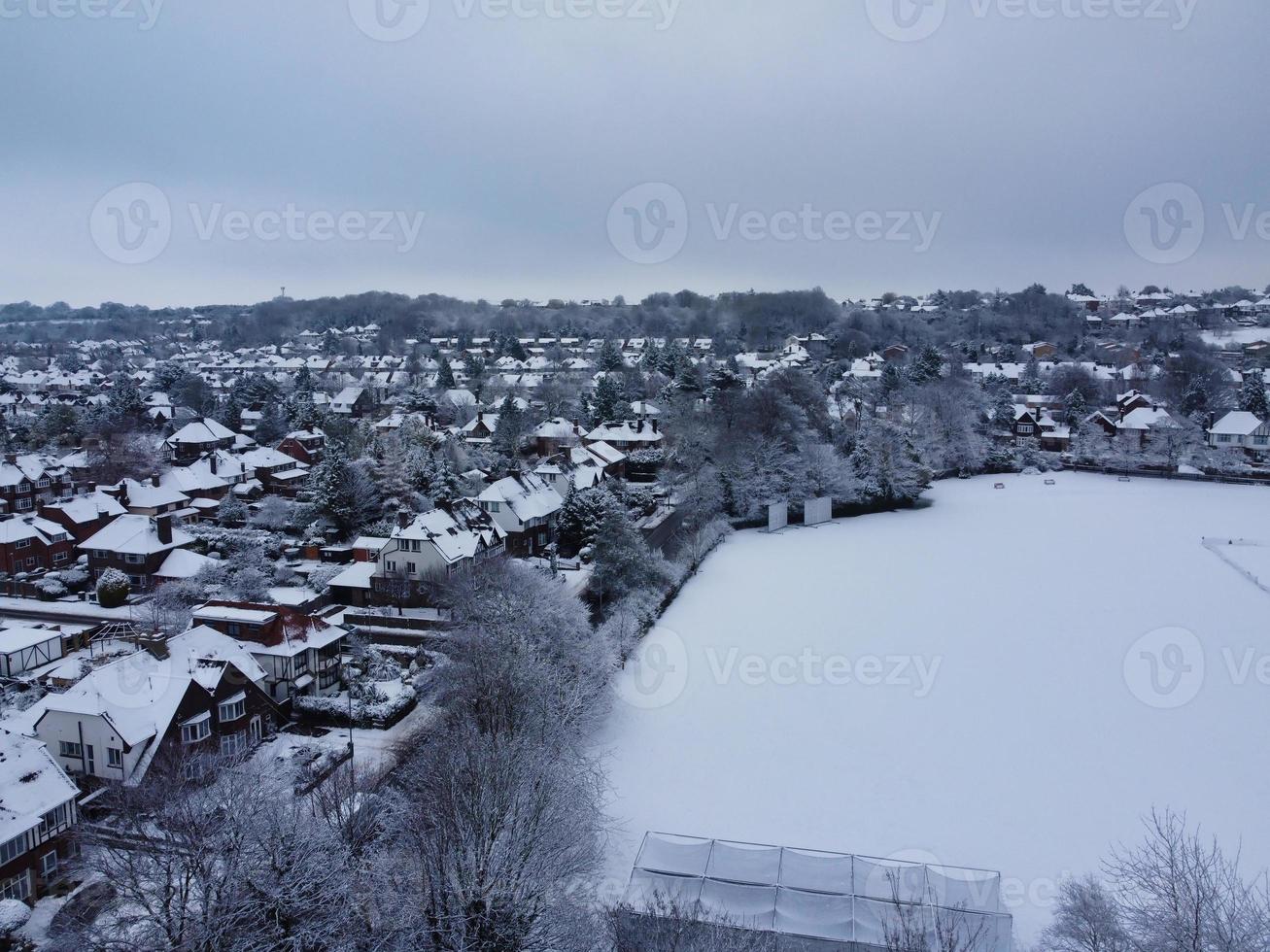 High angle view of Snow covered North Luton's landscape and Cityscape, Aerial Footage of Northern Luton City of England UK after Snow Fall. The 1st Snow Fall of this Winter of 2022 photo