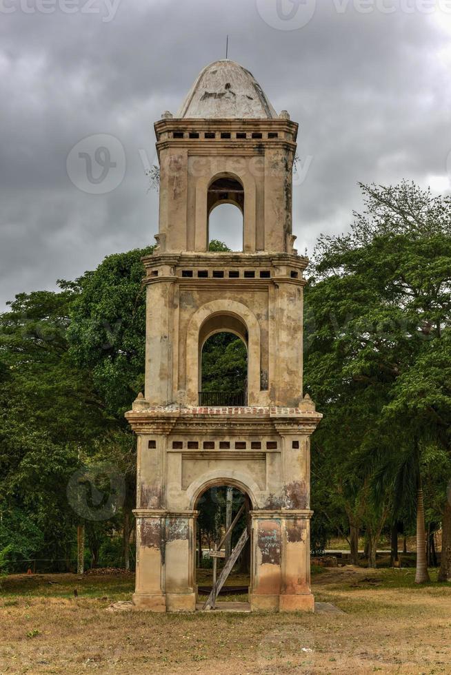 Ruins of the slave tower of the once grand sugar mill Ingenio San Isidro de Los Destiladeros in the Valle de los Ingenios, Trinidad, Cuba photo