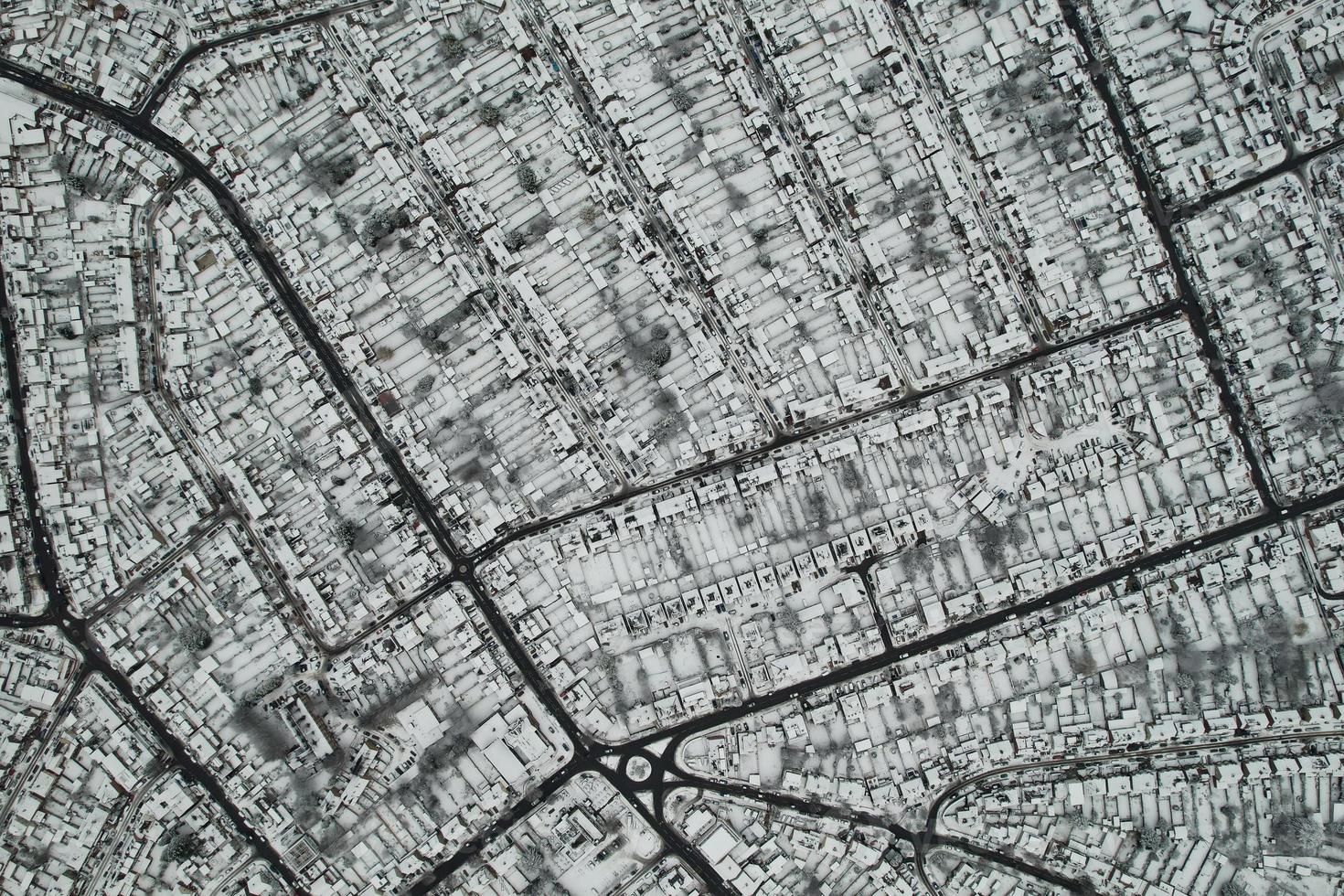 High angle view of Snow covered North Luton's landscape and Cityscape, Aerial Footage of Northern Luton City of England UK after Snow Fall. The 1st Snow Fall of this Winter of 2022 photo