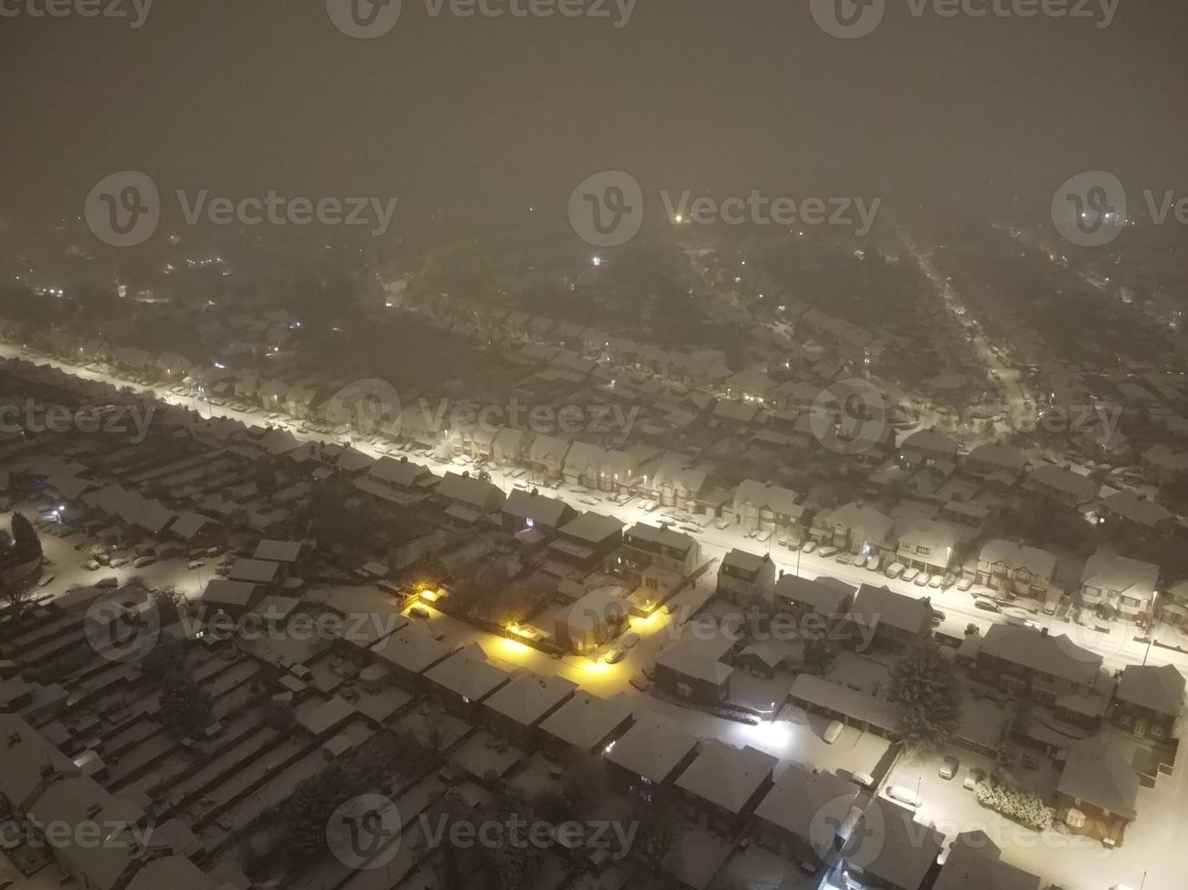 High angle view of Snow covered North Luton's landscape and Cityscape, Aerial Footage of Northern Luton City of England UK after Snow Fall. The 1st Snow Fall of this Winter of 2022 photo