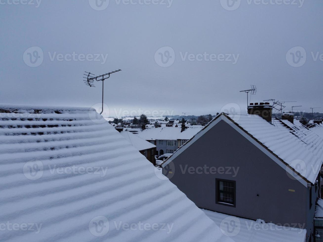High angle view of Snow covered North Luton's landscape and Cityscape, Aerial Footage of Northern Luton City of England UK after Snow Fall. The 1st Snow Fall of this Winter of 2022 photo