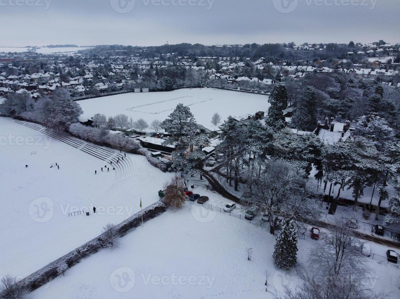 High angle view of Snow covered North Luton's landscape and Cityscape, Aerial Footage of Northern Luton City of England UK after Snow Fall. The 1st Snow Fall of this Winter of 2022 photo