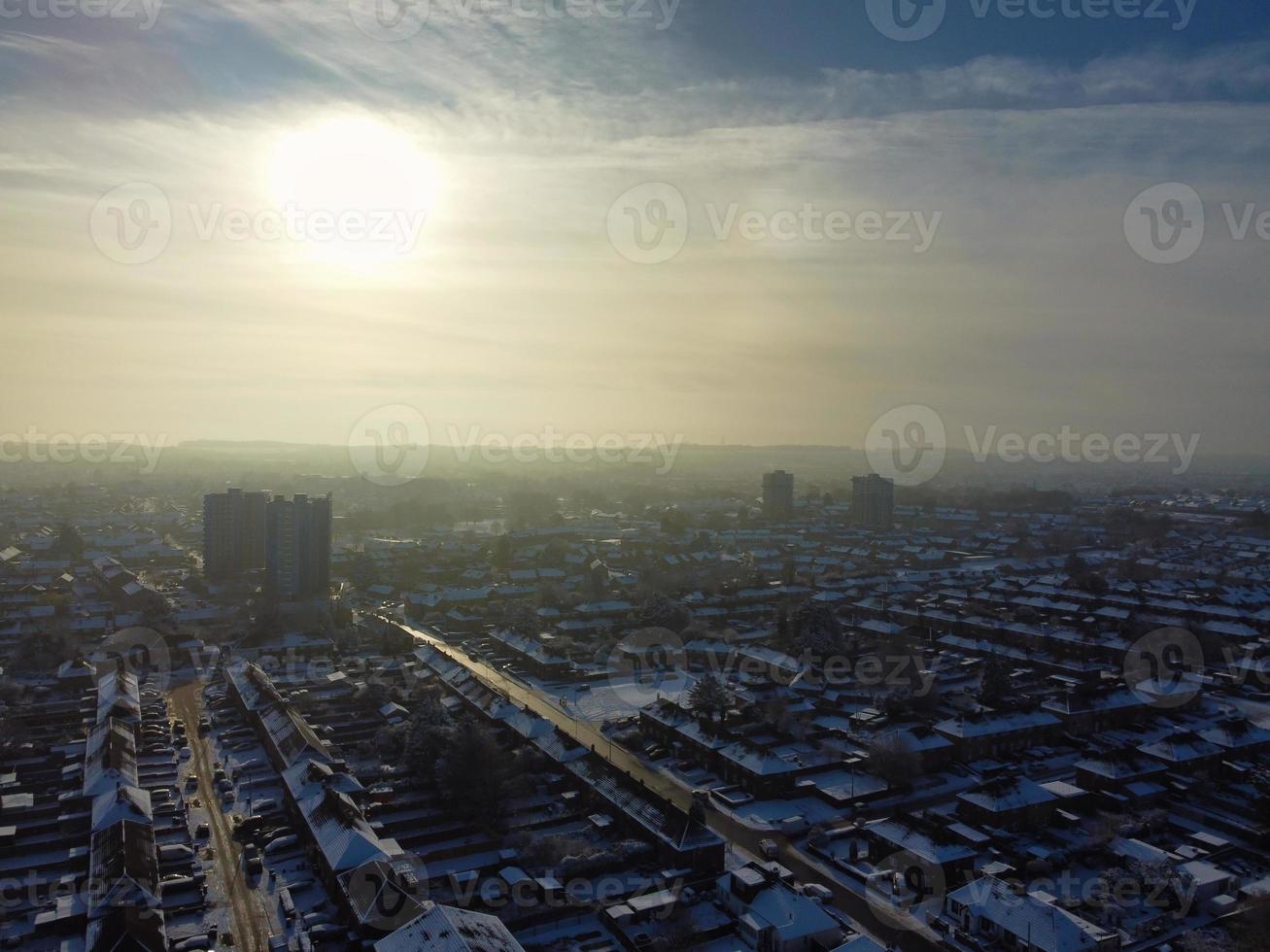 High angle view of Snow covered North Luton's landscape and Cityscape, Aerial Footage of Northern Luton City of England UK after Snow Fall. The 1st Snow Fall of this Winter of 2022 photo