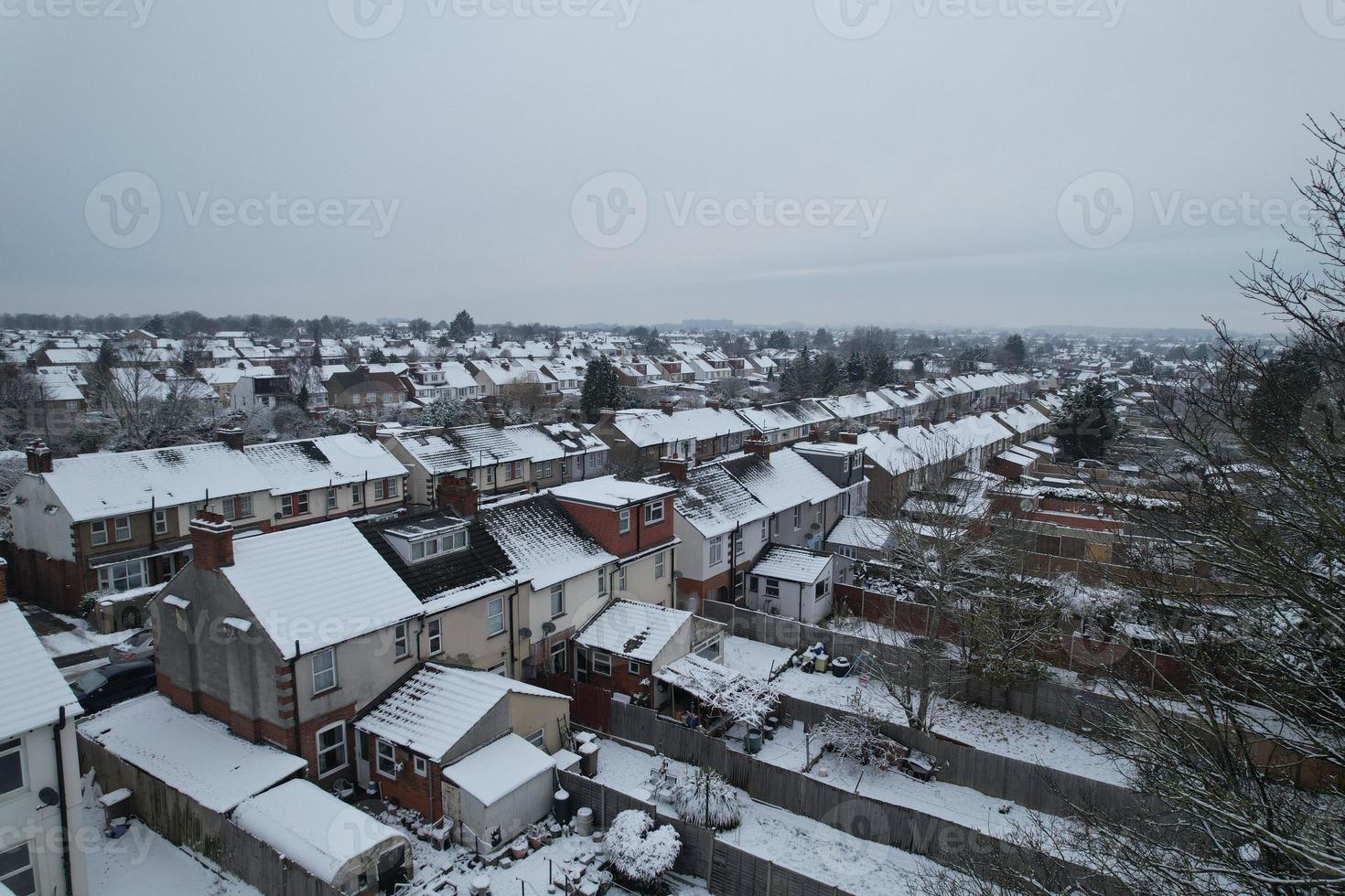 High angle view of Snow covered North Luton's landscape and Cityscape, Aerial Footage of Northern Luton City of England UK after Snow Fall. The 1st Snow Fall of this Winter of 2022 photo