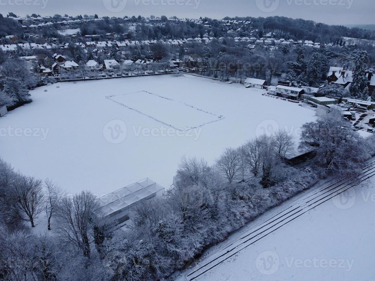 High angle view of Snow covered North Luton's landscape and Cityscape, Aerial Footage of Northern Luton City of England UK after Snow Fall. The 1st Snow Fall of this Winter of 2022 photo