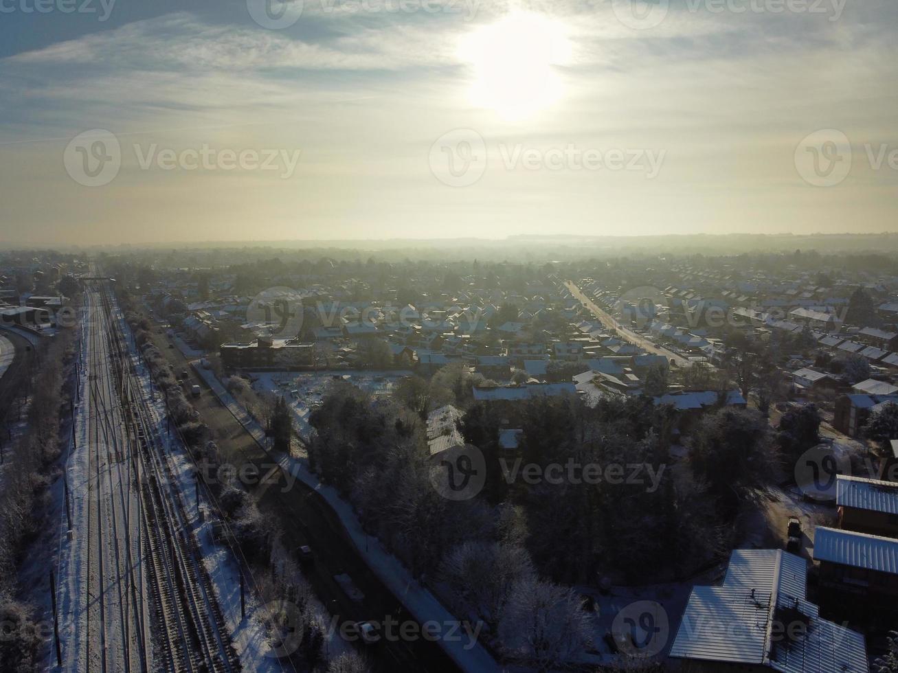 High angle view of Snow covered North Luton's landscape and Cityscape, Aerial Footage of Northern Luton City of England UK after Snow Fall. The 1st Snow Fall of this Winter of 2022 photo