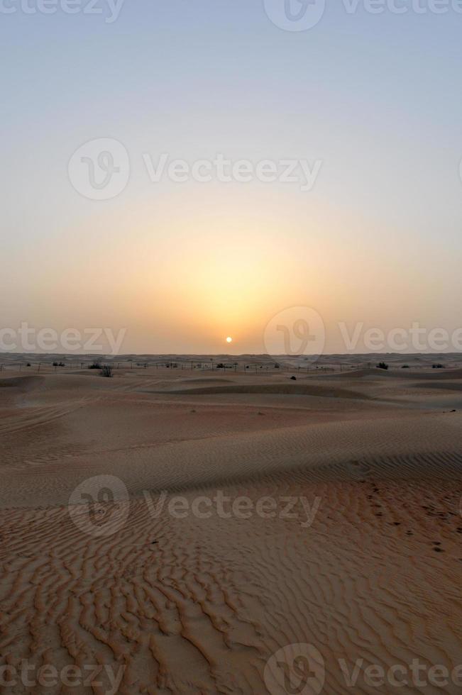 Sunset in Dubai, UAE on a desert safari. photo