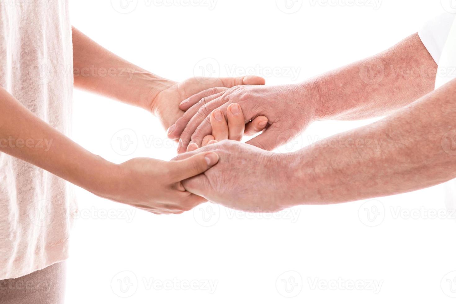 Young female hands and old male hands photo