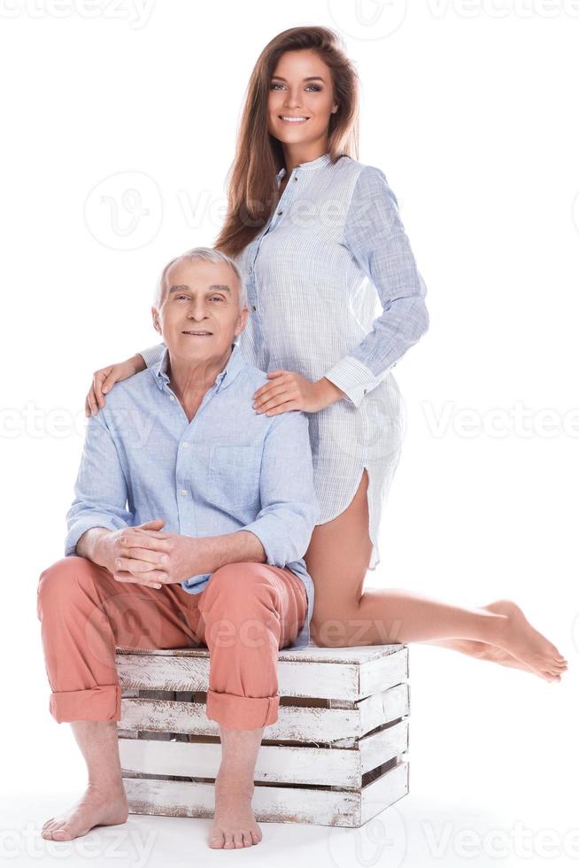 Woman and her eldery father on white background photo