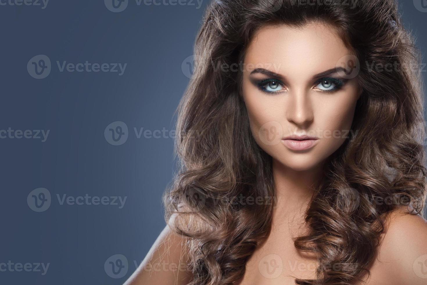 Gorgeous woman with beautiful makeup and hairdo photo