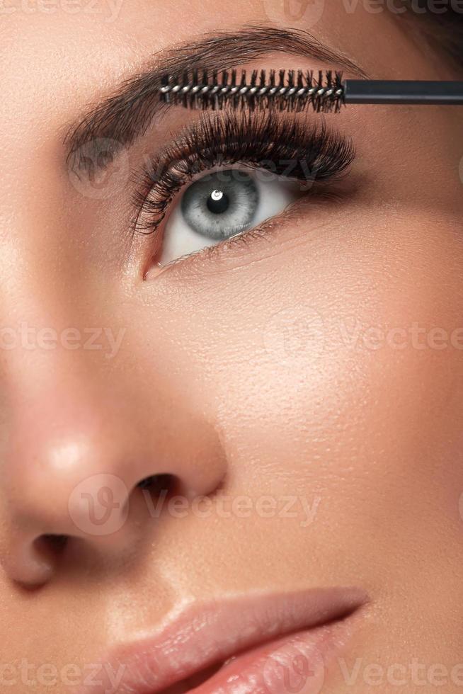 Woman with eyelash extension for maximum volume photo