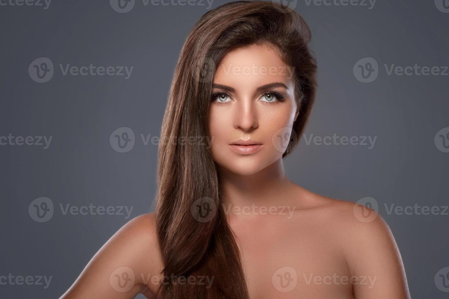 Beautiful and young woman with a artificial eyelashes photo