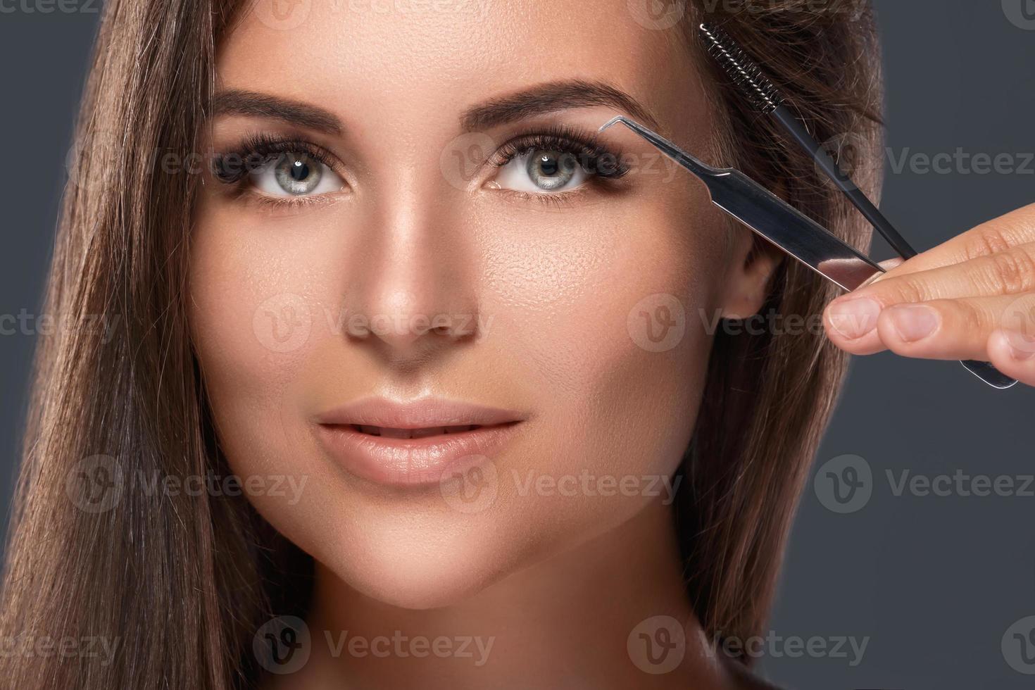 Woman with eyelash extension for maximum volume photo