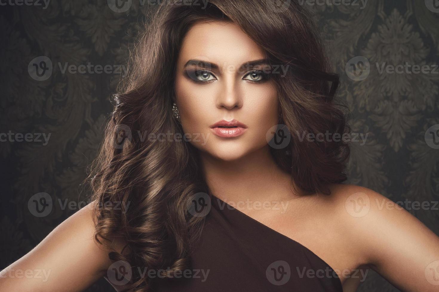 Gorgeous woman with beautiful makeup and hairdo photo