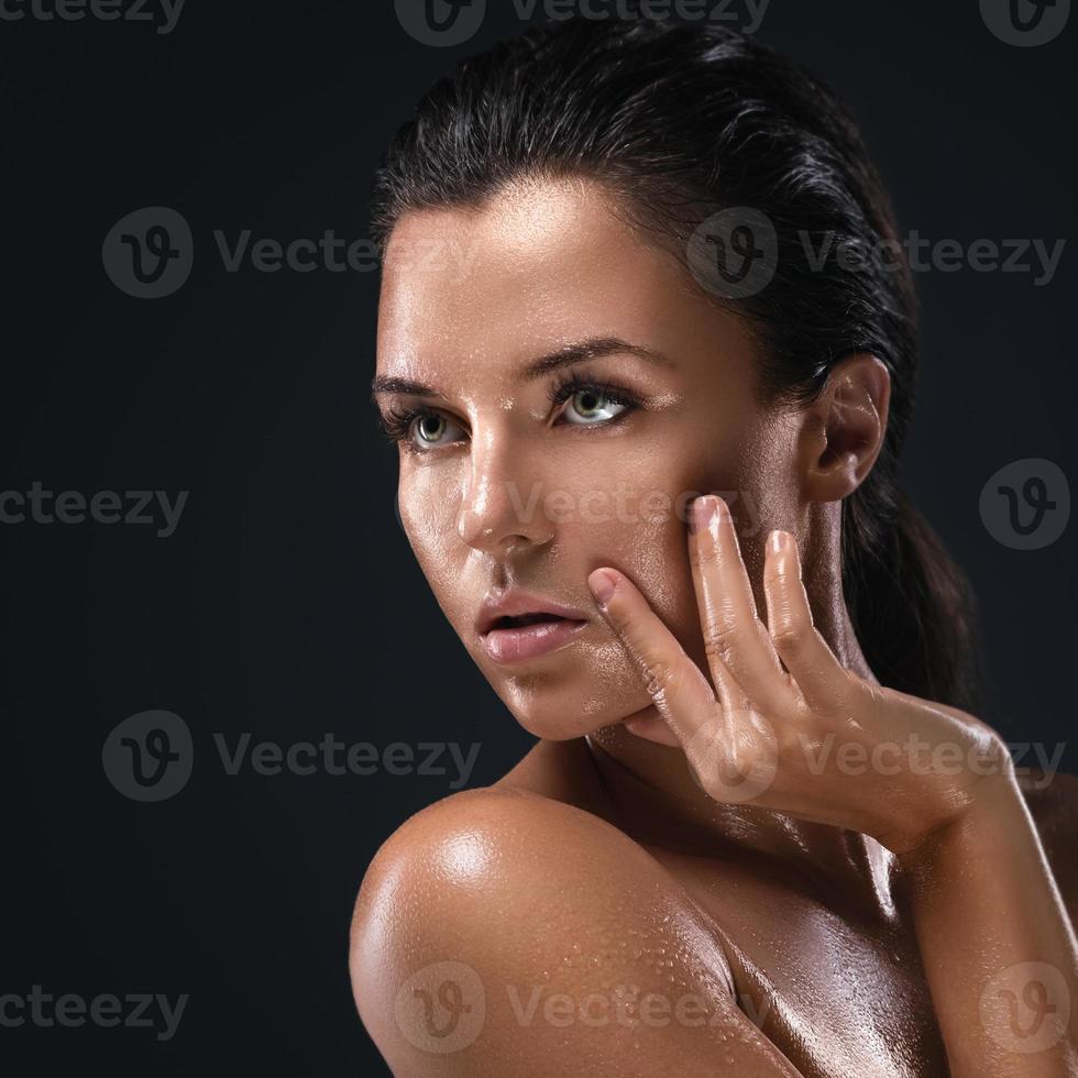 Beautiful woman with oily and wet skin photo
