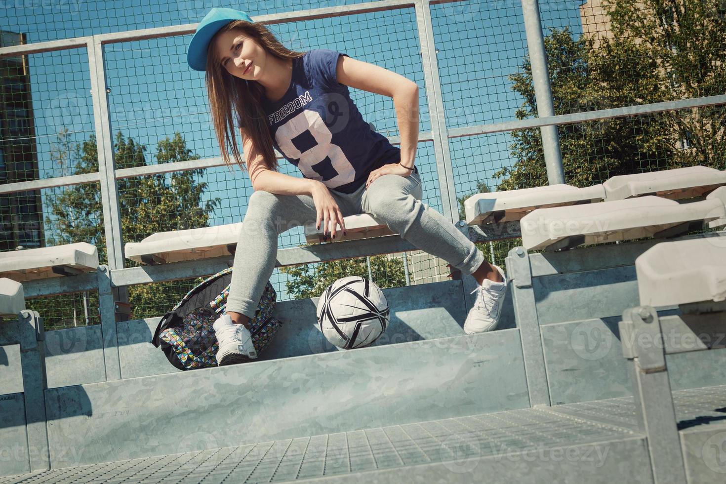 Beautiful teenage girl on the school yard photo