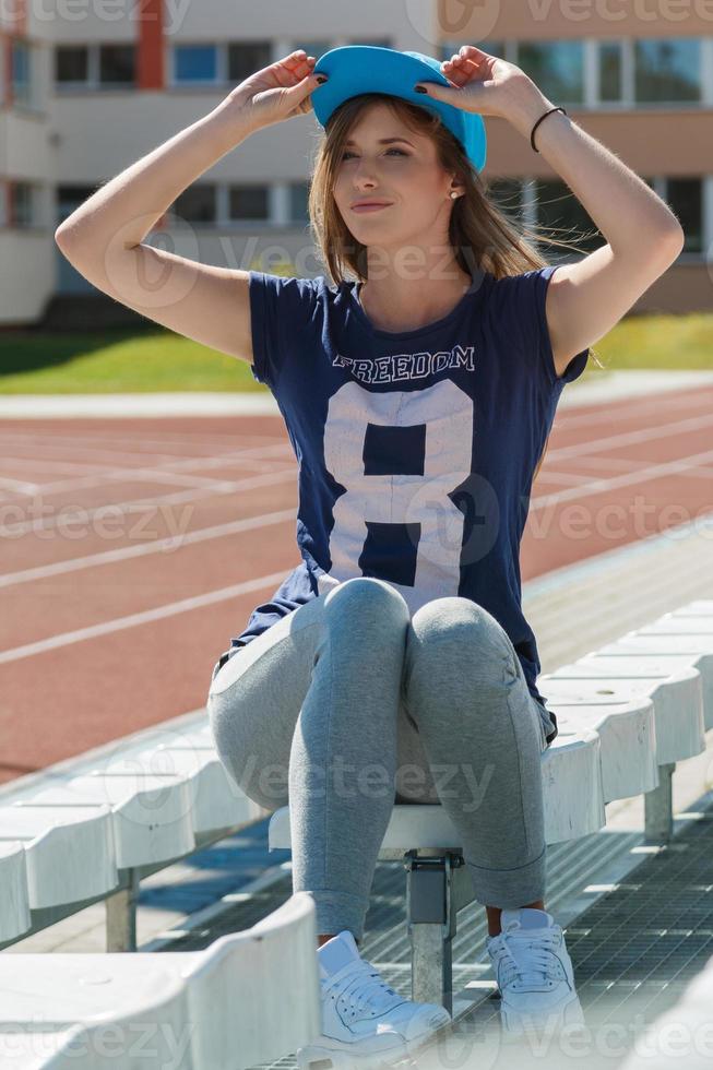 Beautiful teenage girl on the school yard photo