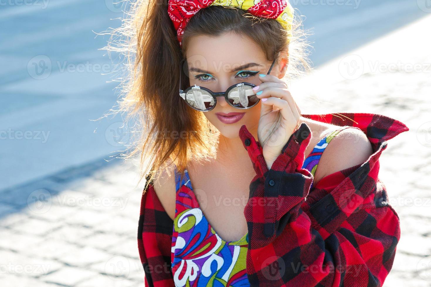 Beautiful and stylish girl on the street photo