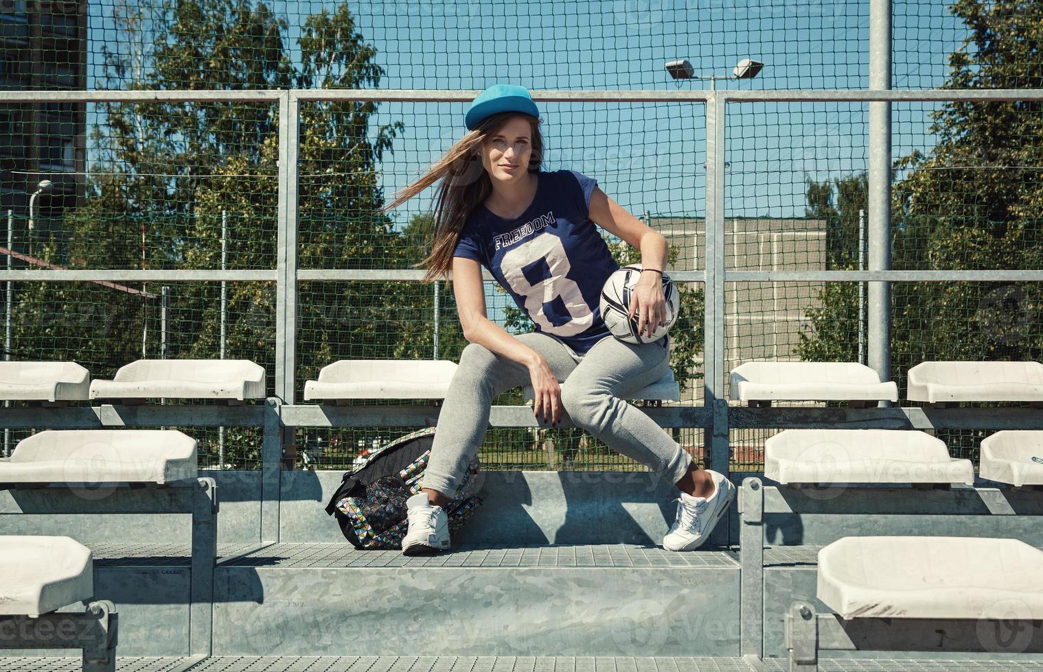 Beautiful teenage girl on the school yard photo