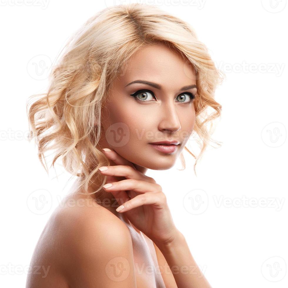 Young beautiful blonde girl on white background photo