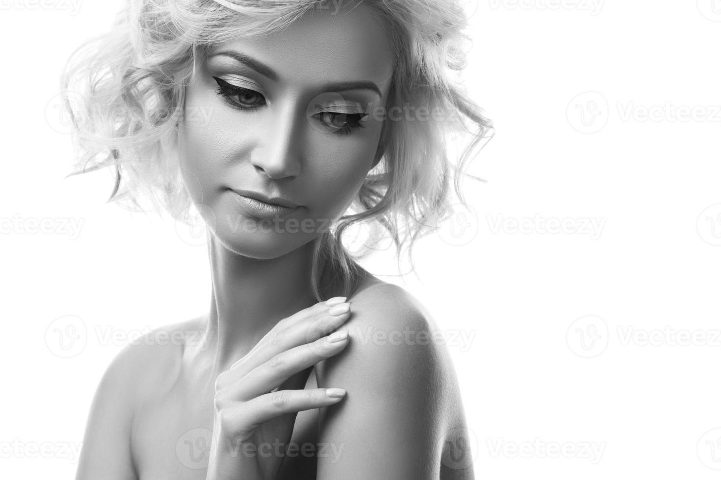 Young beautiful blonde girl on white background photo