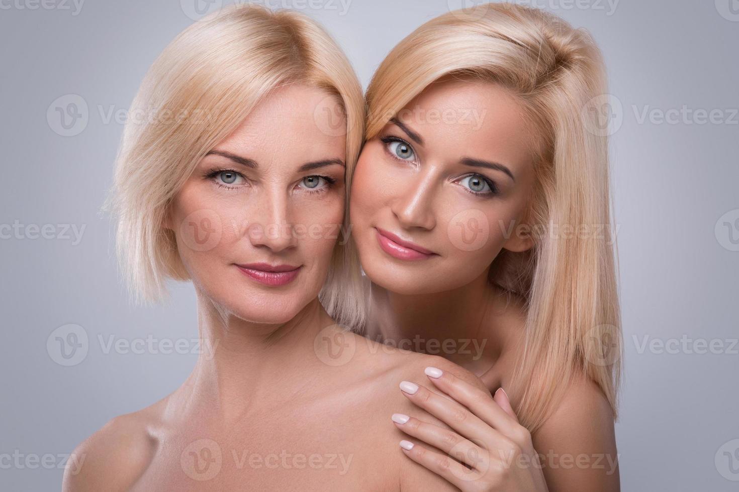 Beautiful middle aged mother and her adult daughter photo