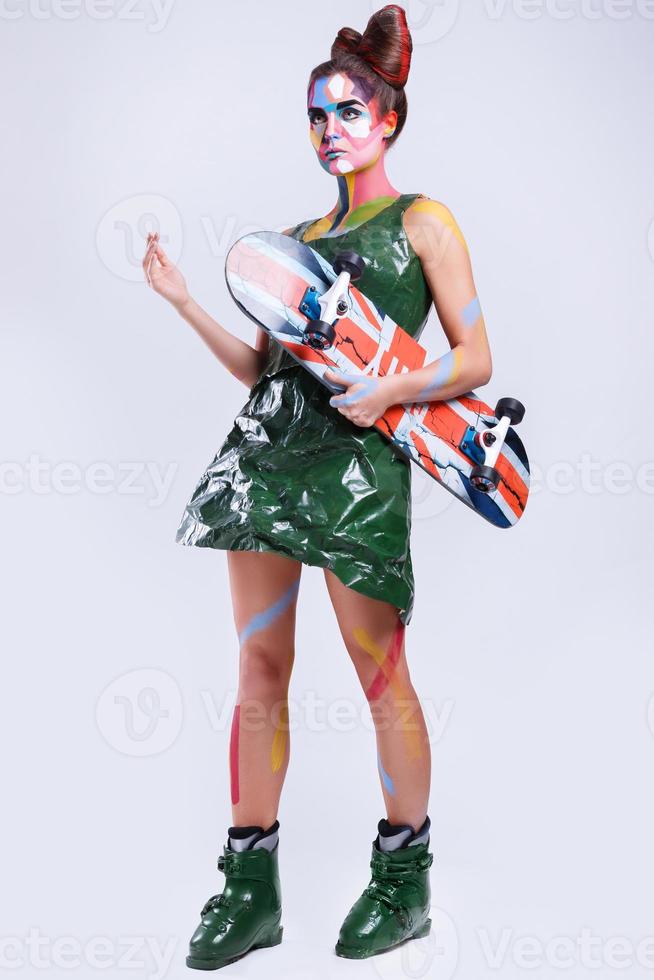 Model in creative image with pop art make-up photo