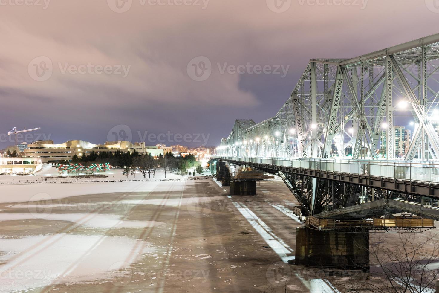 Alexandra Bridge at night connecting Quebec and Ontario, Gatineau and Ottawa in Canada. photo