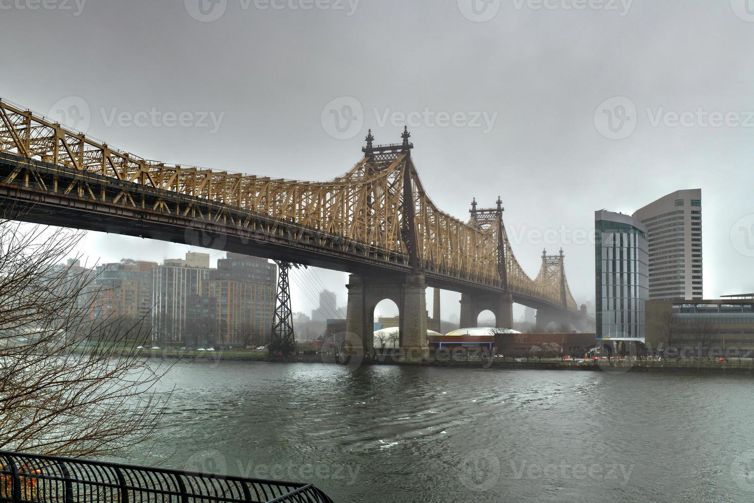 Sutton Place Park North in the Spring as the trees are blooming with a view of the Queensboro Bridge in New York City. photo