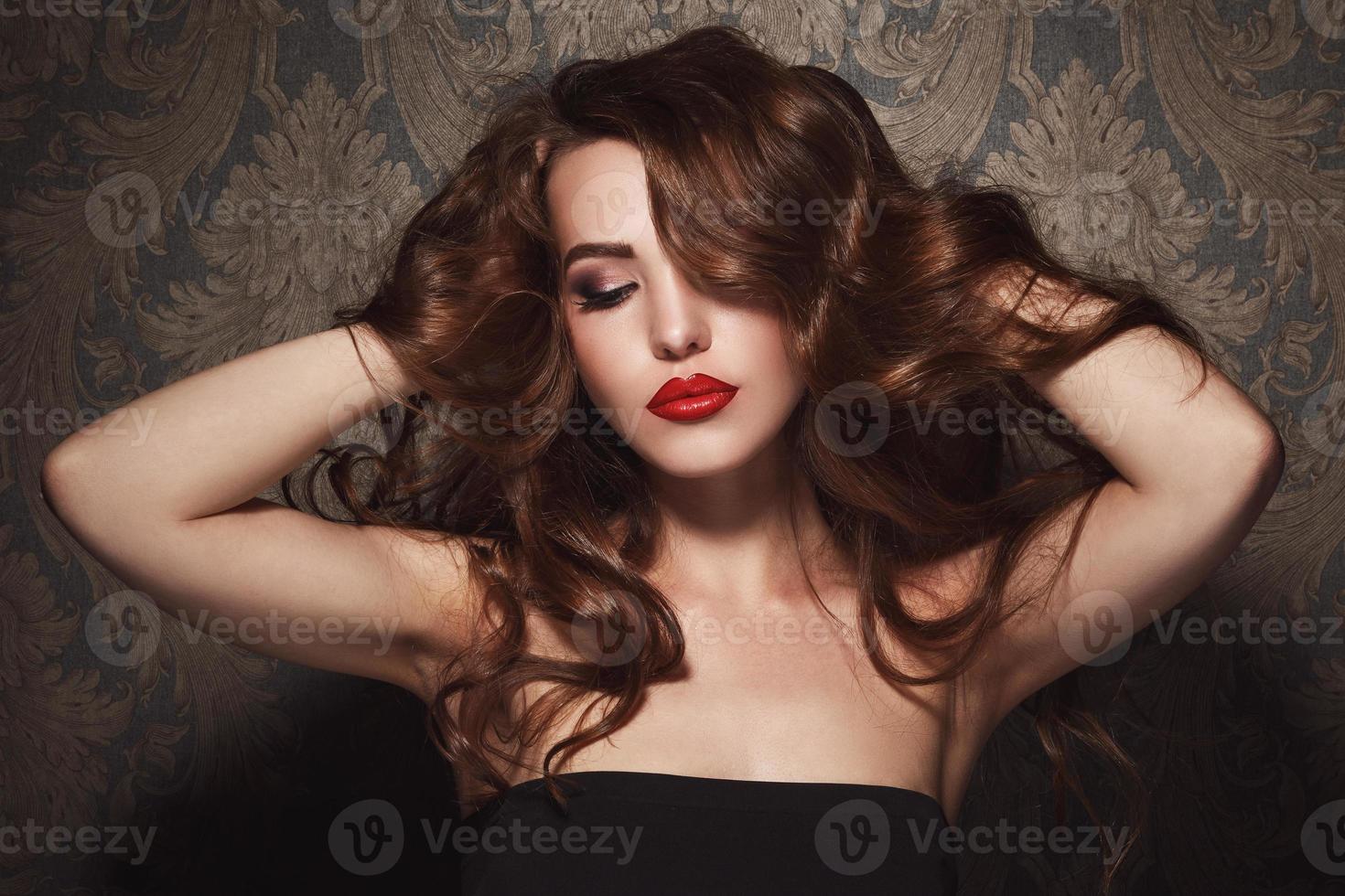 Portrait of beautiful woman with red lips photo