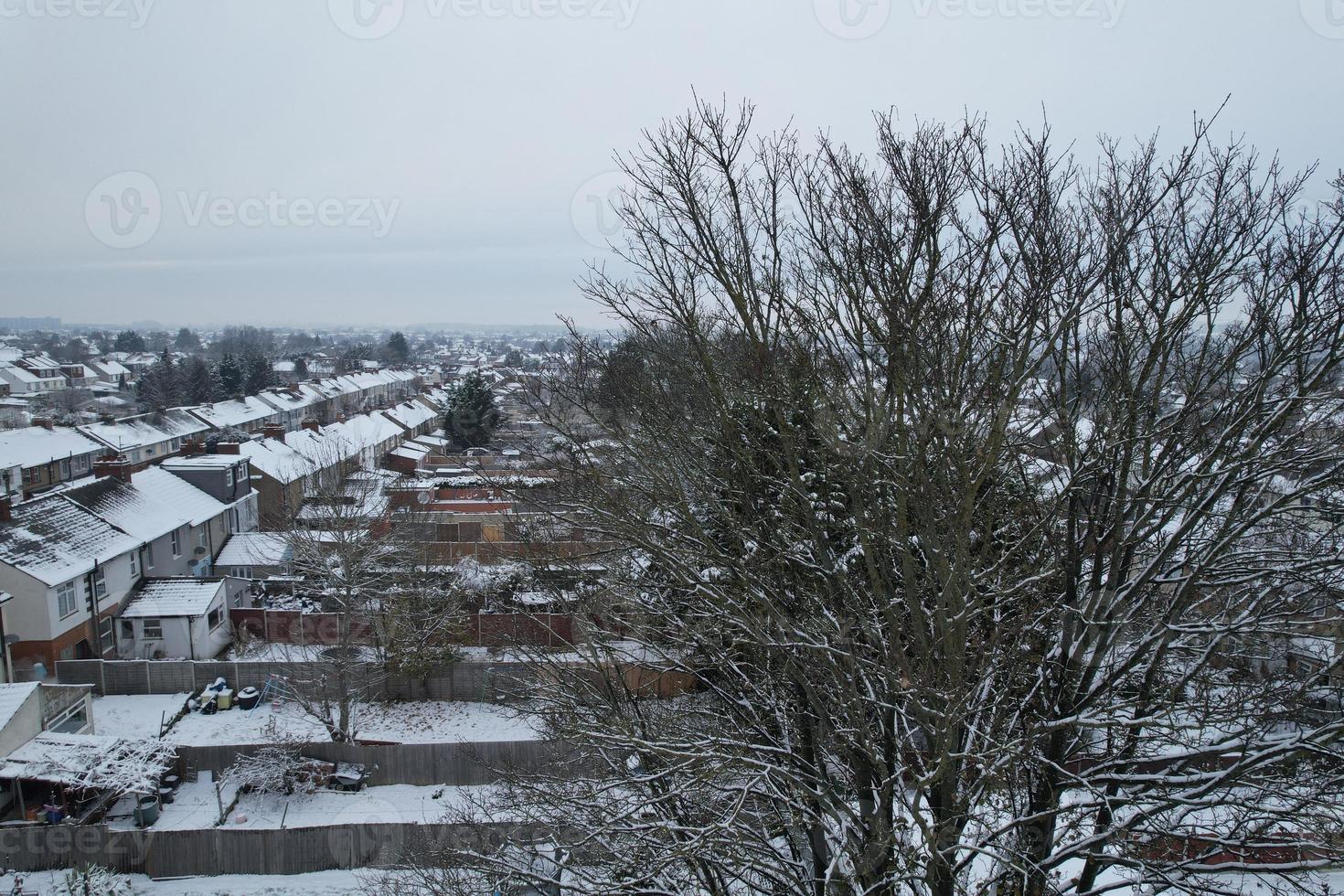 High angle view of Snow covered North Luton's landscape and Cityscape, Aerial Footage of Northern Luton City of England UK after Snow Fall. The 1st Snow Fall of this Winter of 2022 photo