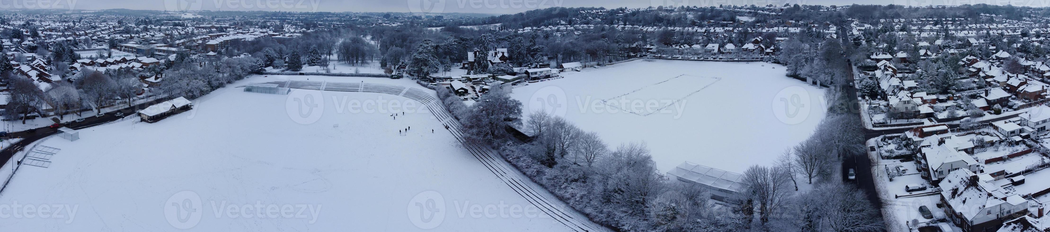 High angle view of Snow covered North Luton's landscape and Cityscape, Aerial Footage of Northern Luton City of England UK after Snow Fall. The 1st Snow Fall of this Winter of 2022 photo