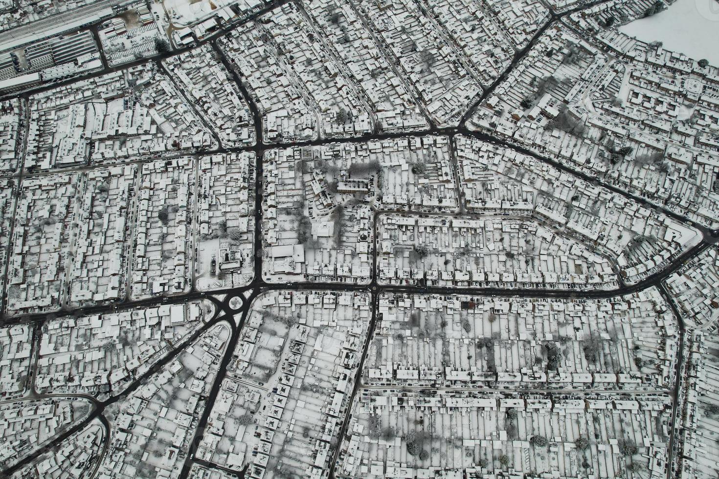 High angle view of Snow covered North Luton's landscape and Cityscape, Aerial Footage of Northern Luton City of England UK after Snow Fall. The 1st Snow Fall of this Winter of 2022 photo