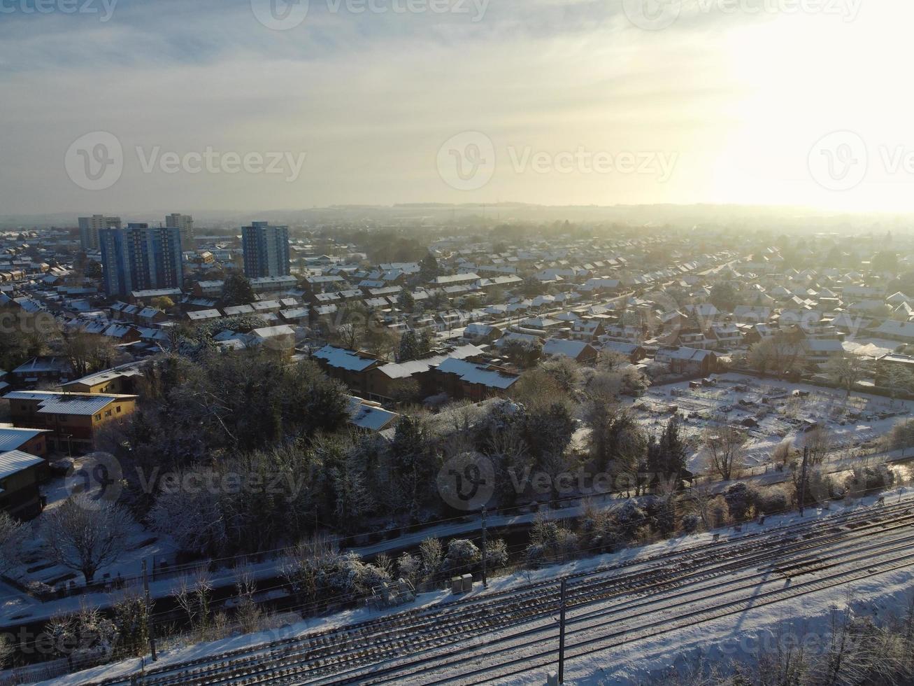 High angle view of Snow covered North Luton's landscape and Cityscape, Aerial Footage of Northern Luton City of England UK after Snow Fall. The 1st Snow Fall of this Winter of 2022 photo