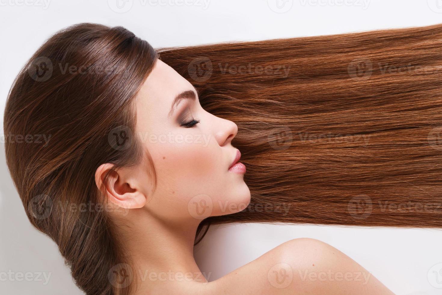 Woman with beautiful long hair on white background photo