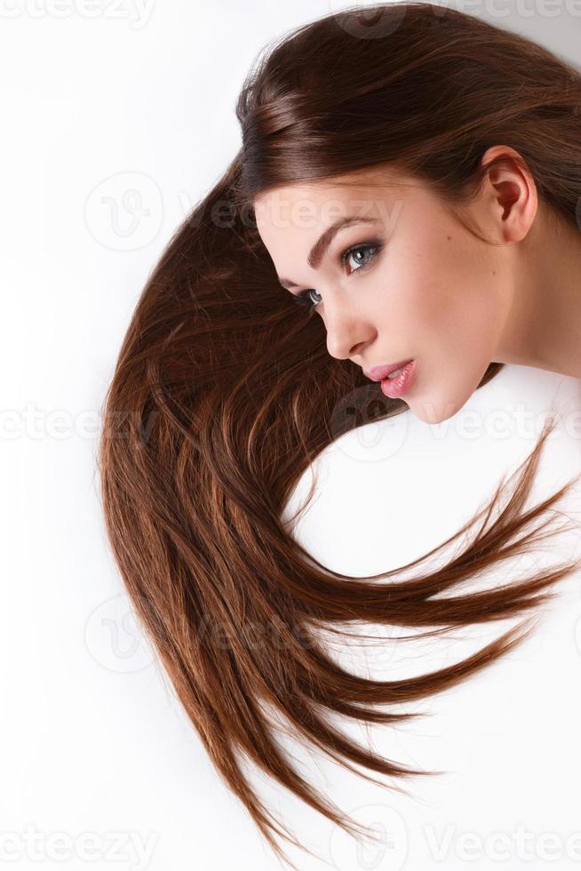 Woman with beautiful long hair on white background photo